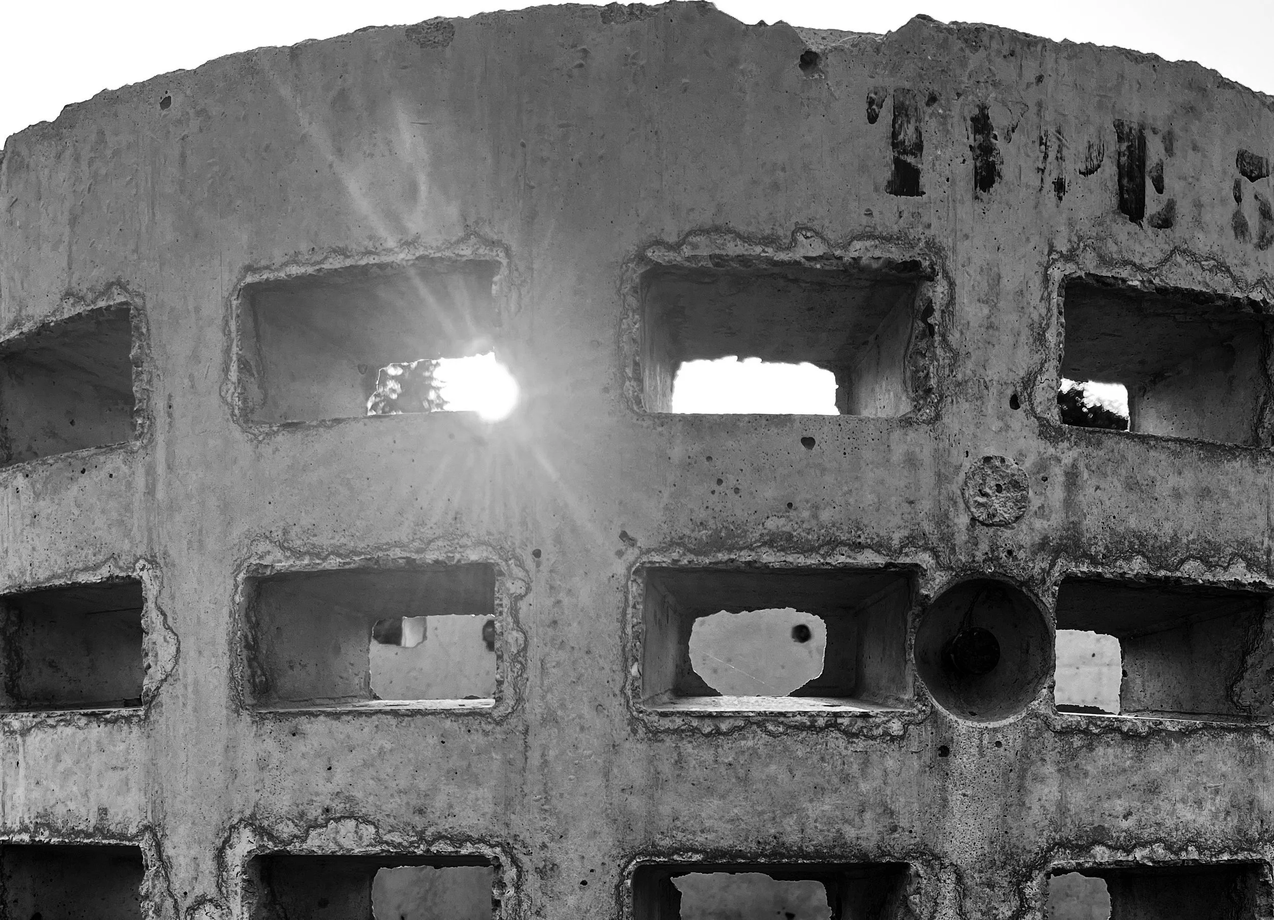 Concrete bunker with sunlight breaking through, symbolizing emotional resilience, strength and perseverance through hardship.