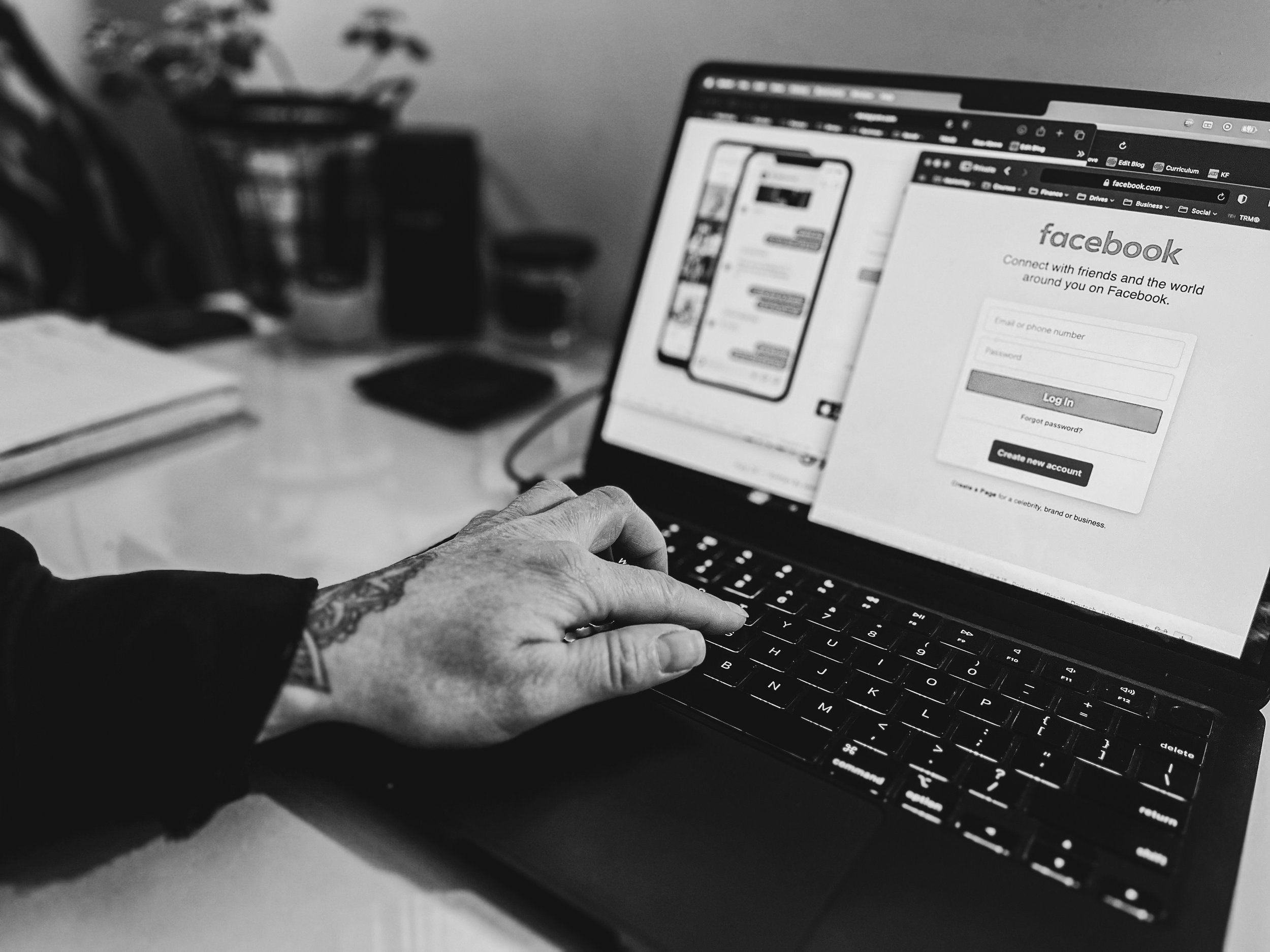 Person working on a computer displaying a social media login screen, symbolizing online influence, shame-based marketing, and protecting personal power.