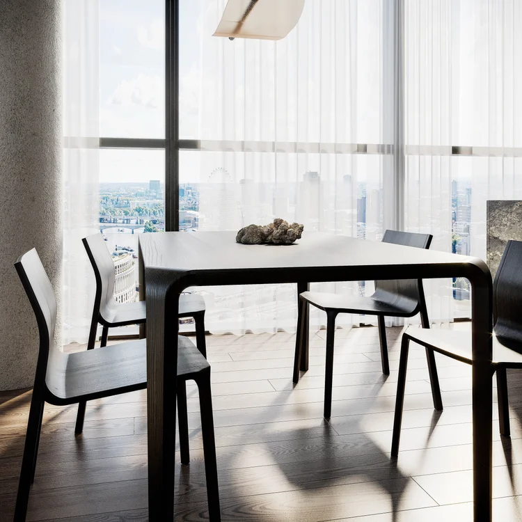 An interior detail from the Loma Visual portfolio: a dark dining table in natural light.