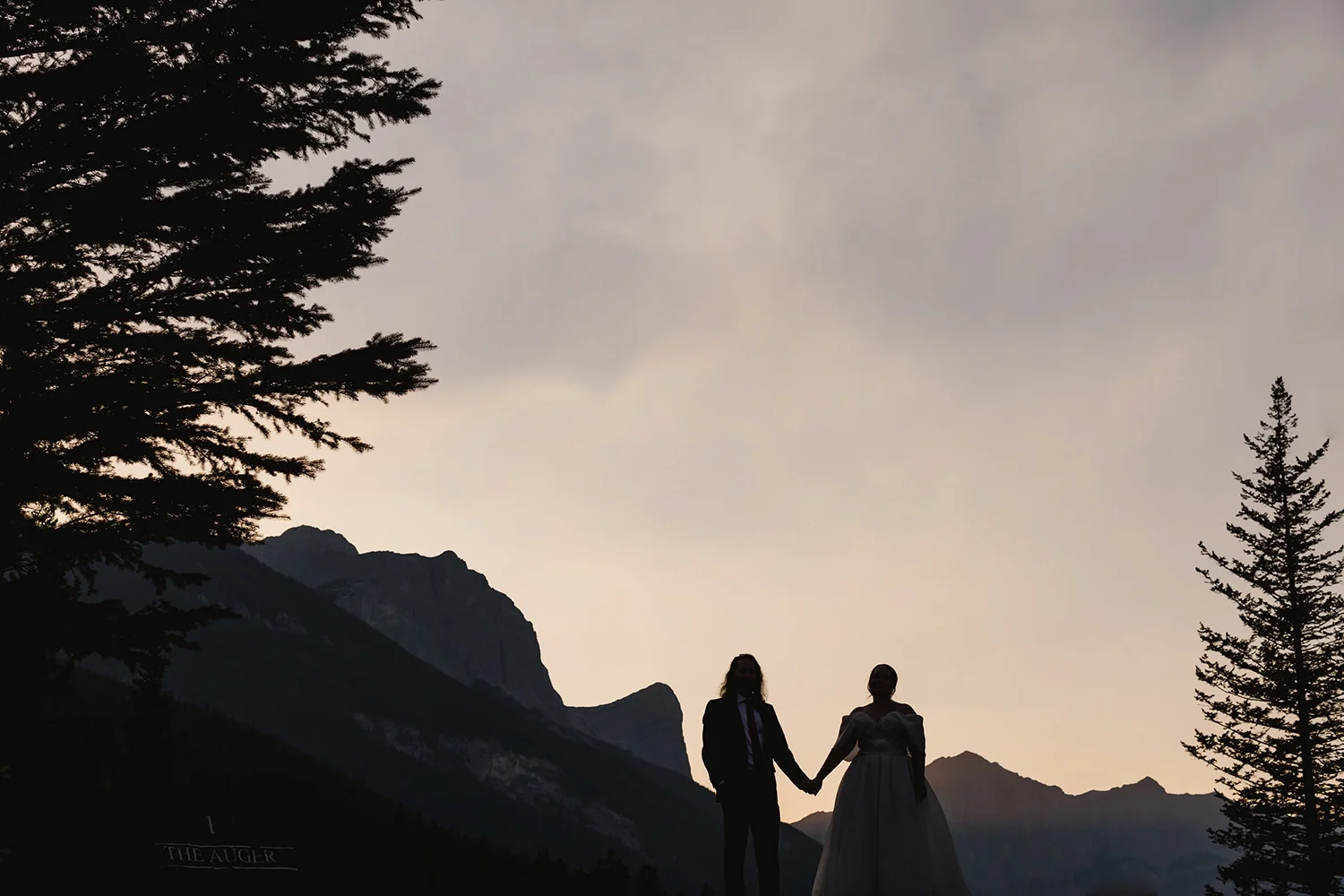 kendal-and-kevin-silhouette-mountain-portrait-wedding-canmore.webp