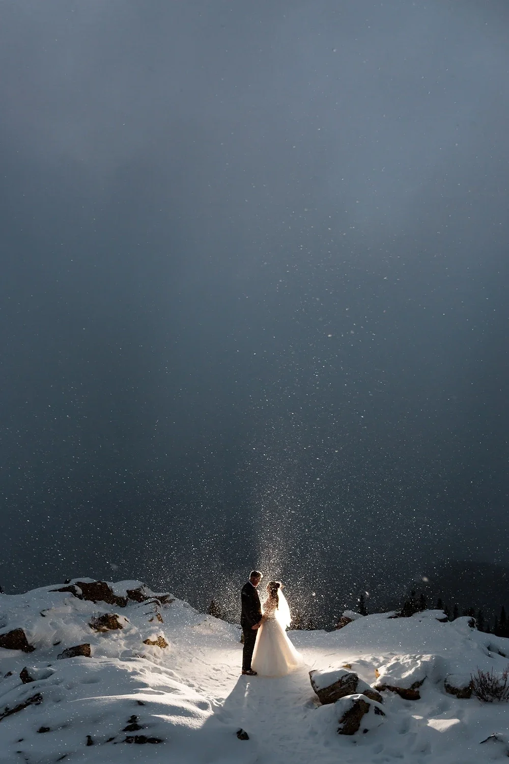 kendal-and-kevin-backlit-snowglobe-wedding-portrait.webp