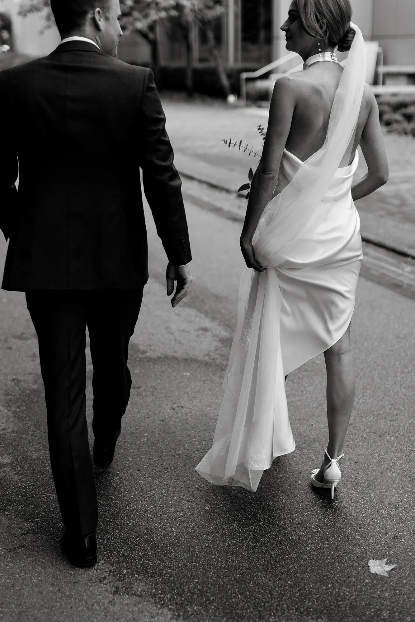 kendal-and-kevin-vancouver-wedding-portrait-monochrome-walking-away.webp