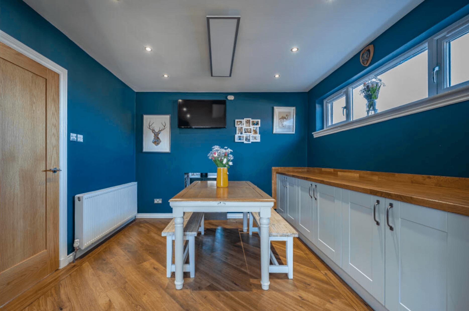 Original enclosed dining and TV room in 1970s Lenzie villa before extension Caption: The old dining and TV room — small, enclosed, and lit only by a narrow window.
