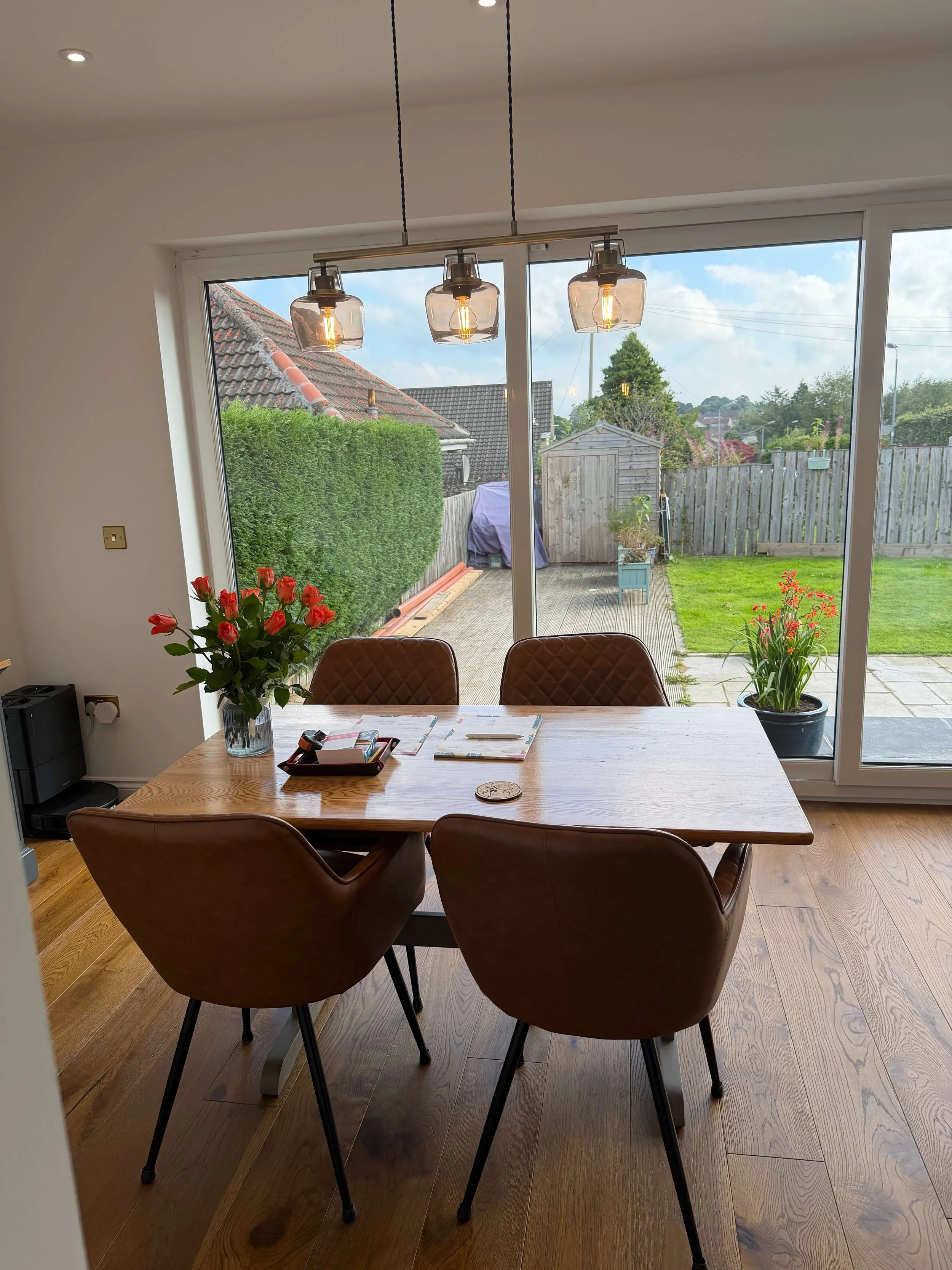 New rear extension dining area with sliding doors and natural light, Lenzie villa renovation