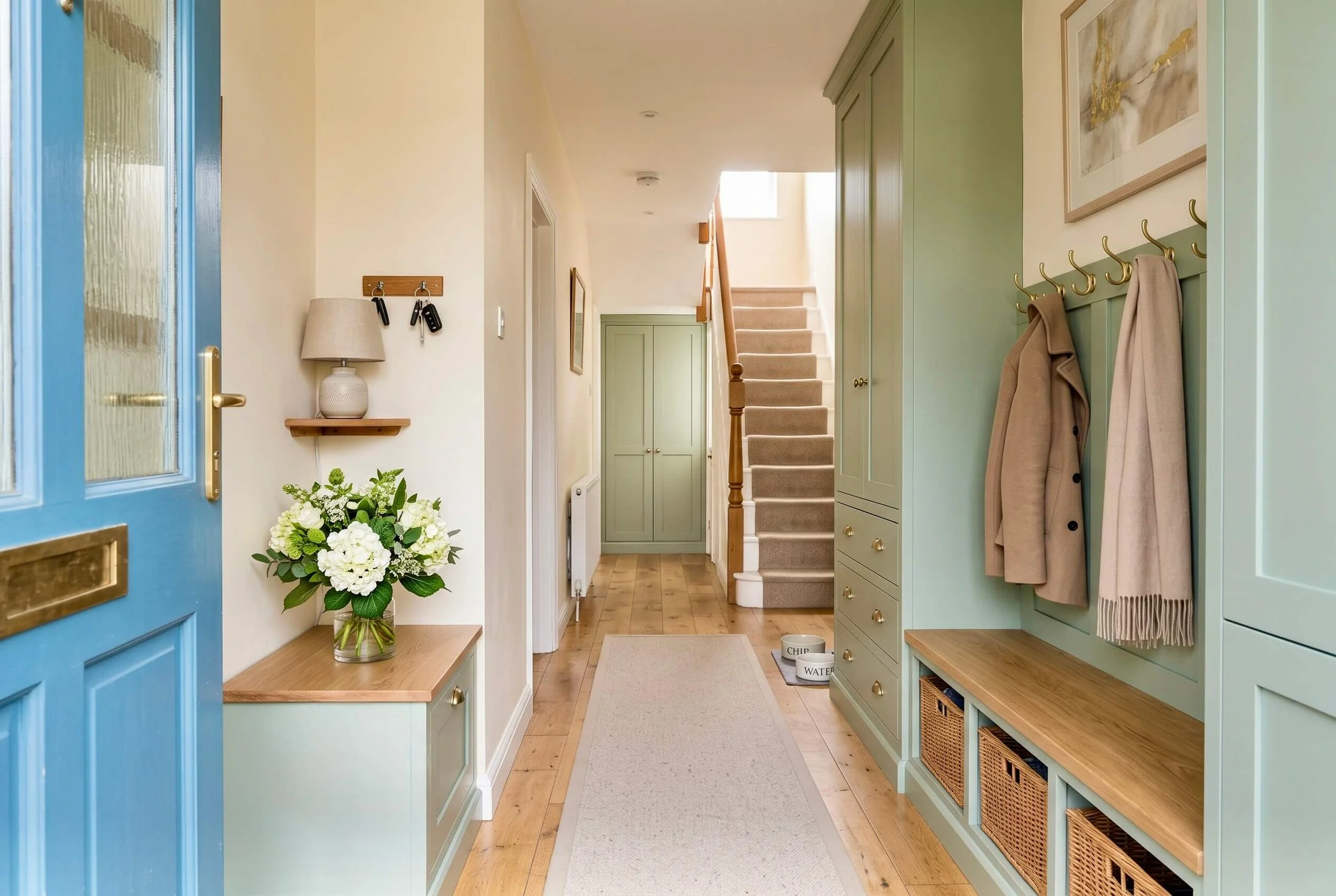 Spacious organised hallway with built-in shoe and coat storage, designed by Interior Space Design in Glasgow