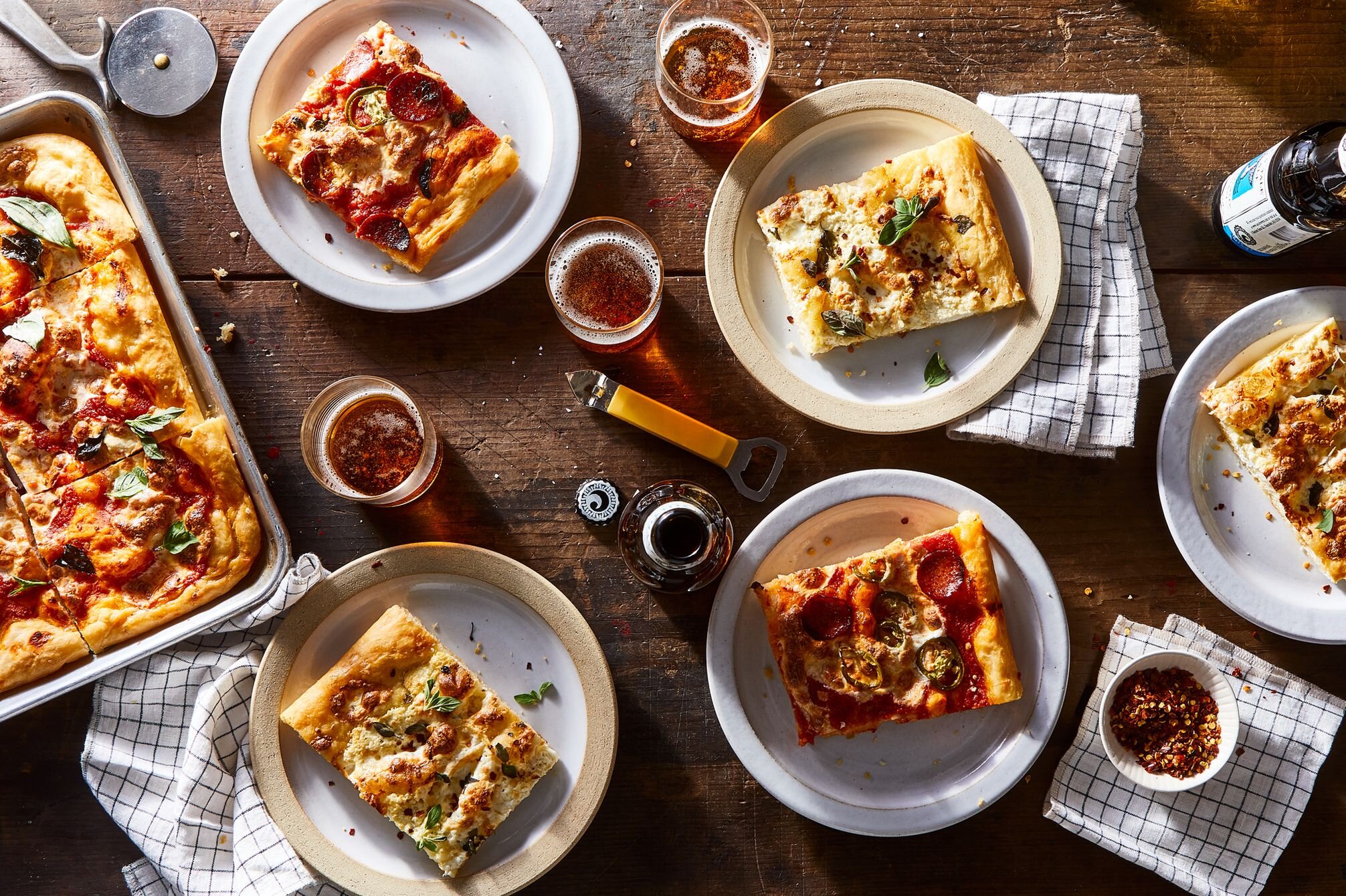 1351a48d-fe14-49e6-b967-41a67bc8c604--2019-0129_lazy-weeknight-pizza-baked-slices_3x2_julia-gartland_163.jpg