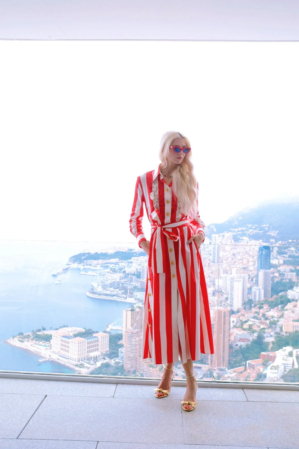 Wearing Schiaparelli Red and White striped button down dress