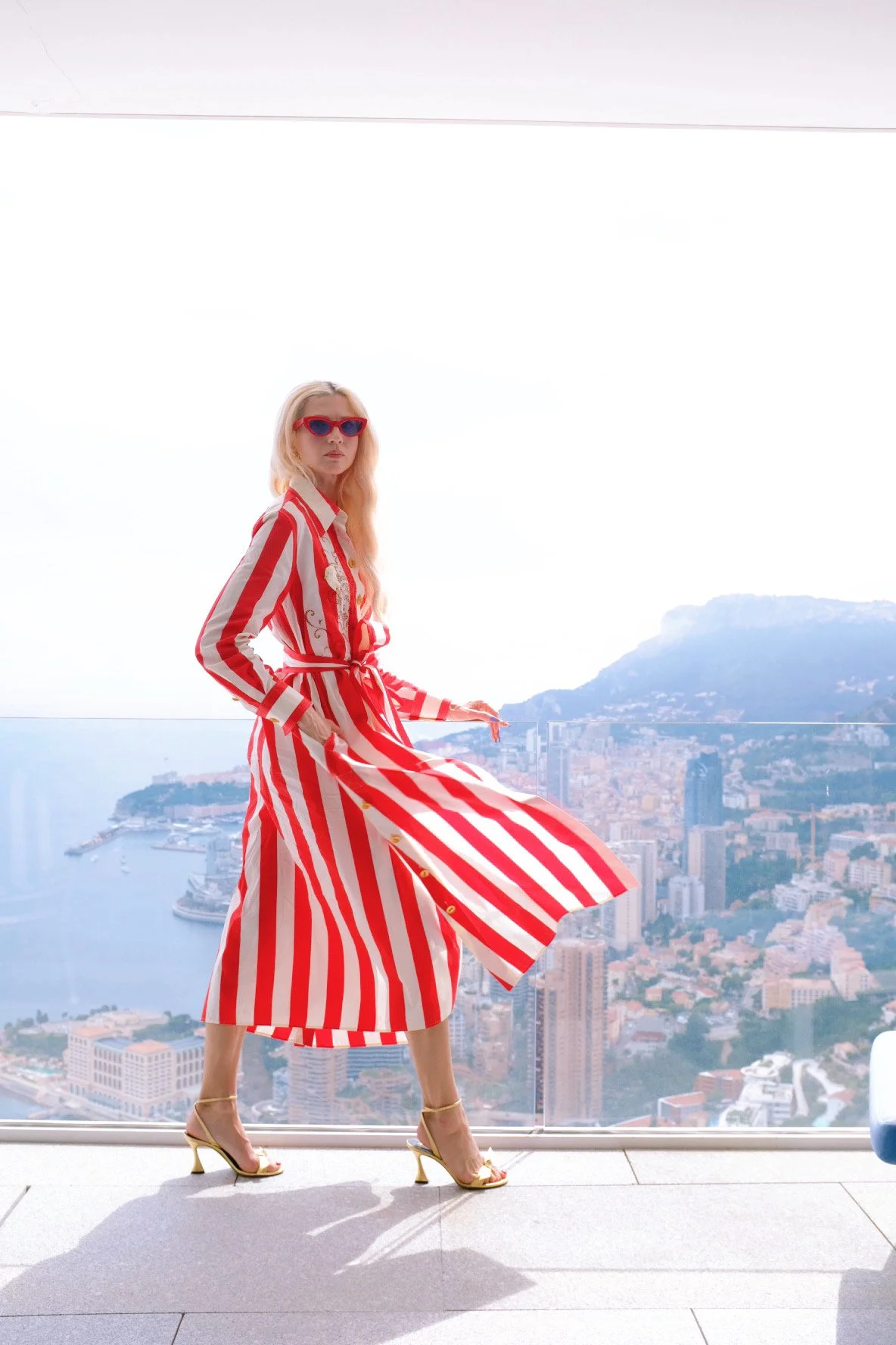Wearing Schiaparelli Red and White striped button down dress