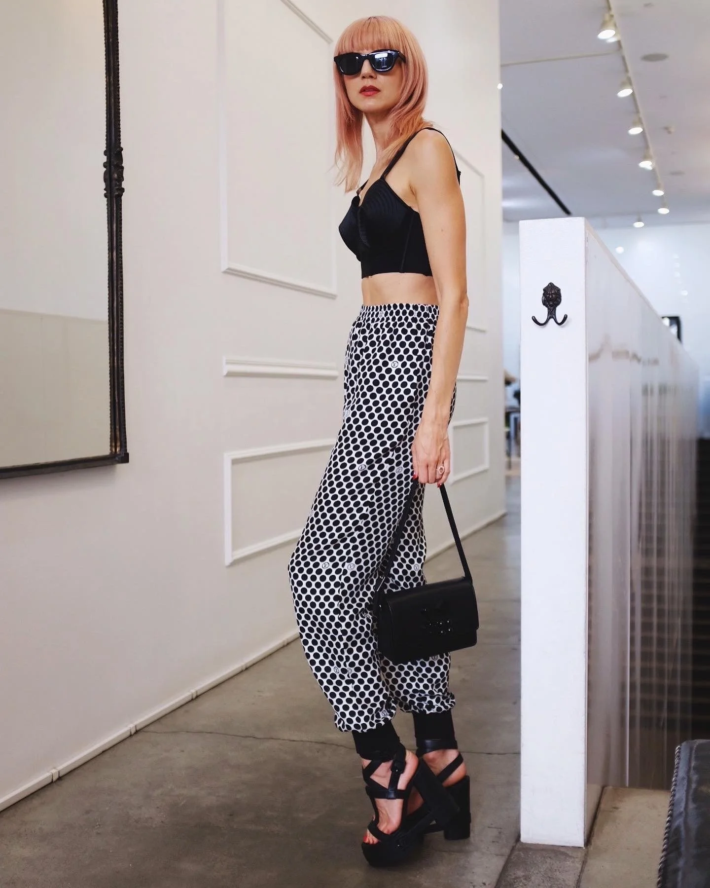 Wearing Christian Louboutin shoes and handbag, Louis Vuitton pants, Jean Paul Gaultier Bustier, Thierry Lasry Sunglasses. Keywords: Soho, NYC, New York, Streetstyle, NYFW, Fashion Week, Christian Louboutin, Shoes, Platforms, Louis Vuitton, Pink Hair