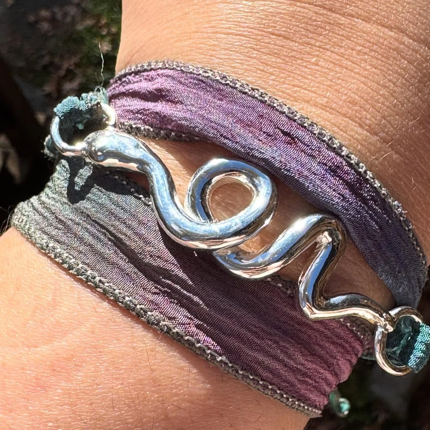 just a lil snake to slither around your wrist 🐍 carved by me, cast in solid sterling silver and finished by me too! tied up with hand-dyed silk 🎀 #snakejewelry #wrapbracelet #silverjewlery #handmade
