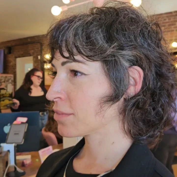 Emily (she/her) has been growing her hair out for over a year from a pixie. We were finally able cut her a cute bob! From the client selfies I've gotten, I'd say it was a hit! 

#queerhairstylist #transhairstylist #lexingtonky #curlybob