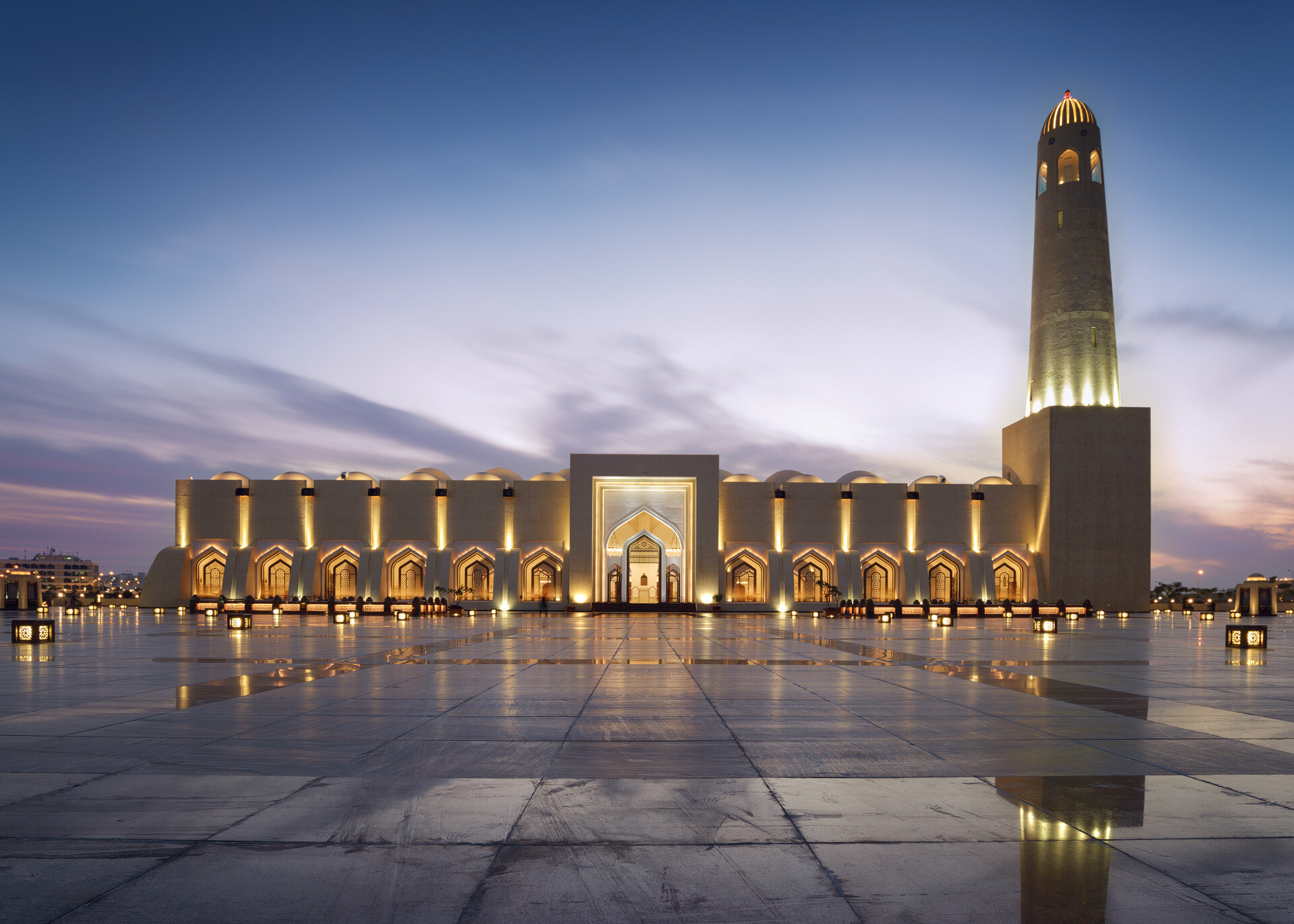 Symmetrical blue hour architectural photo of the Imam Muhammad bin Abdul Wahhab Mosque facade with plaza reflections in Doha Qatar by Hammad Iqbal