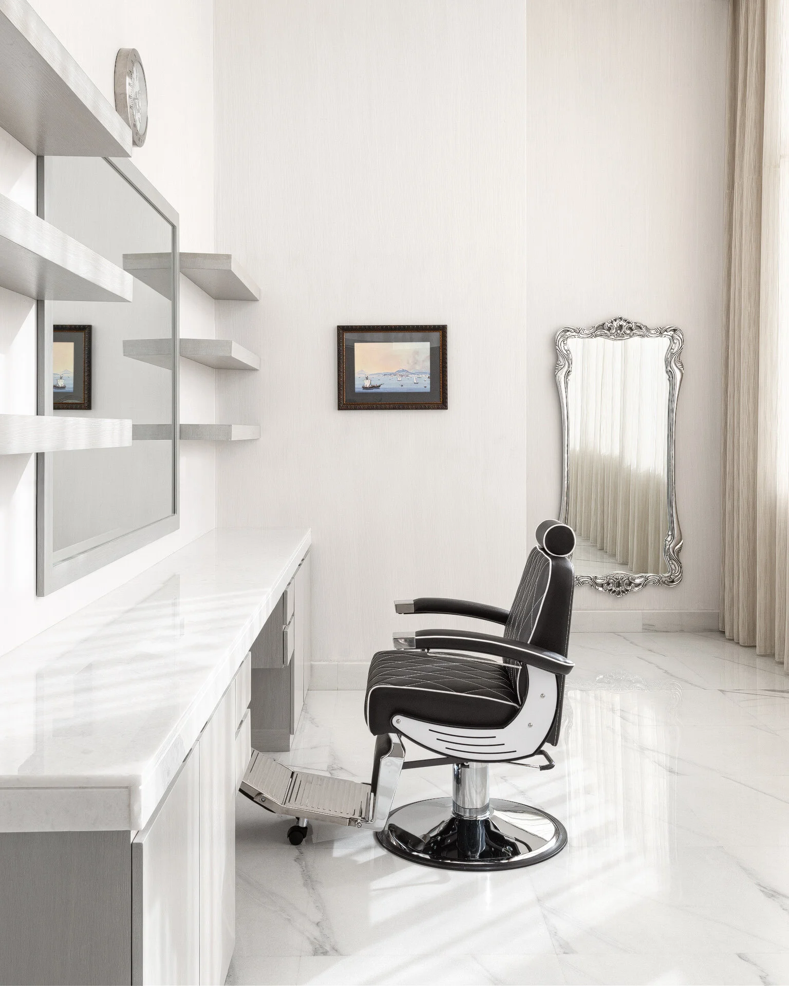 Bright private home barber salon with vintage leather chair white marble vanity and full length mirror in a luxury West Wukair villa by Hammad Iqbal