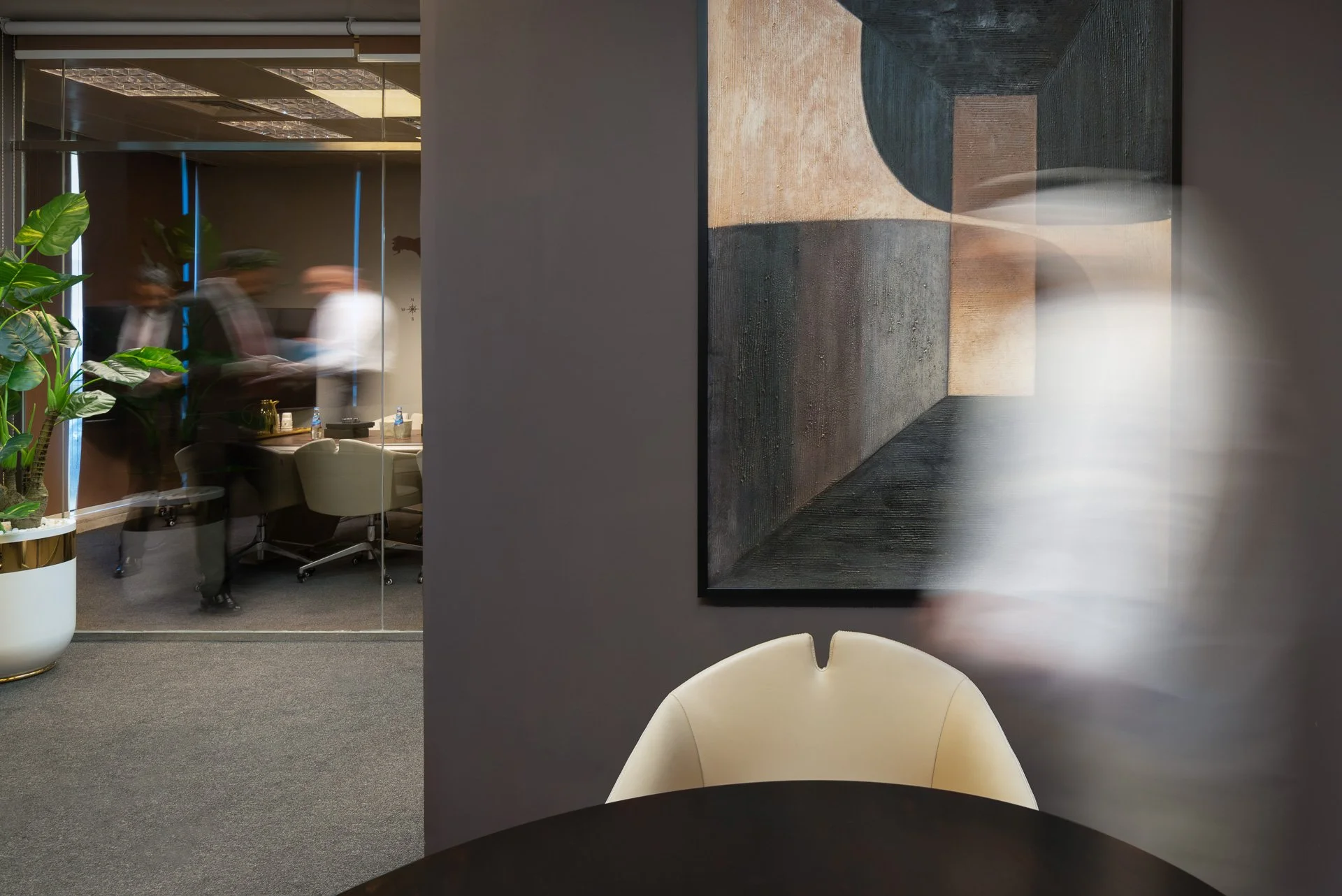Commercial interior photo showing motion blur walk-through past abstract artwork in a law firm by Hammad Iqbal