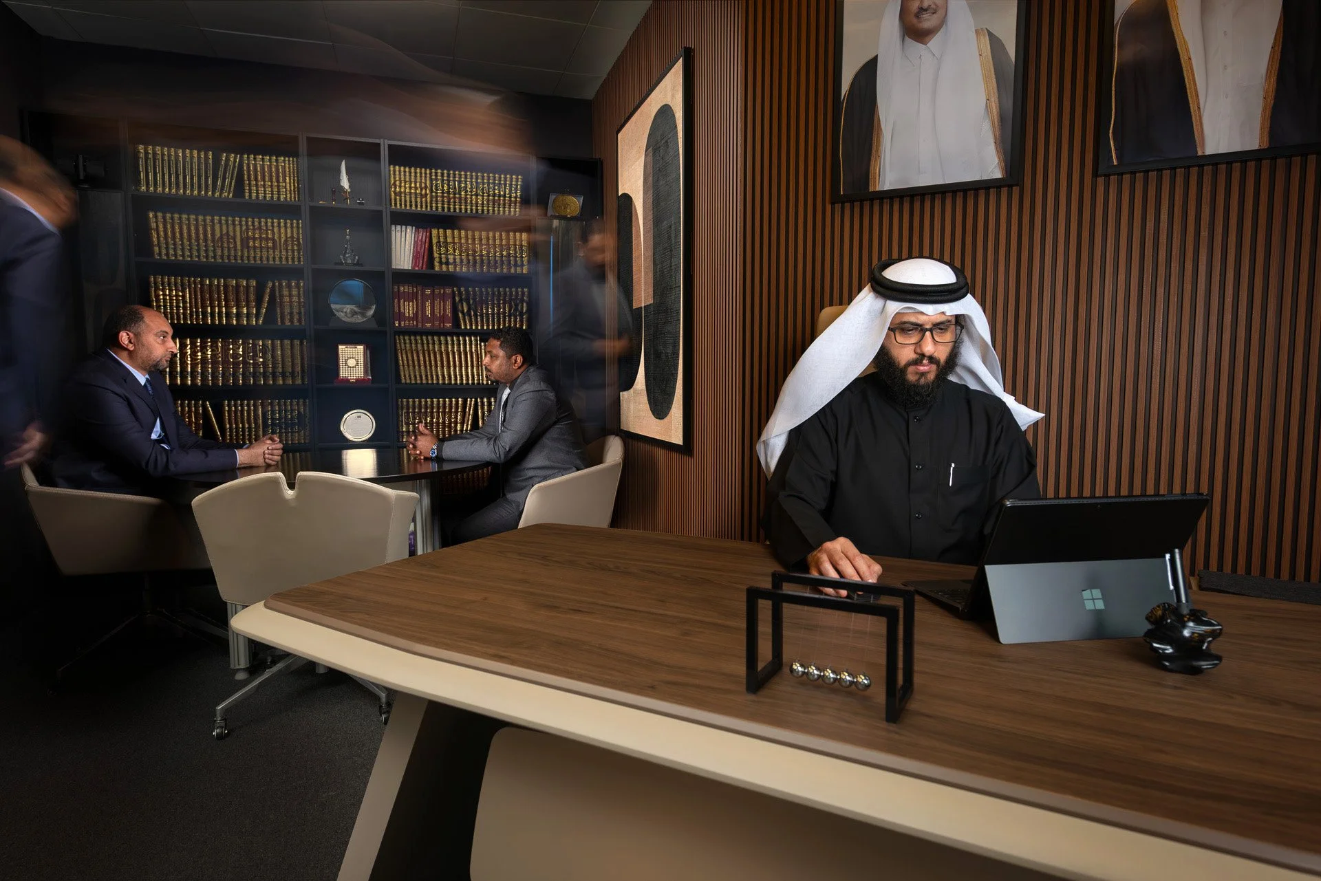 Attorney Abdulla Al-Mulla at his executive desk in a wood paneled legal office in Doha by Hammad Iqbal