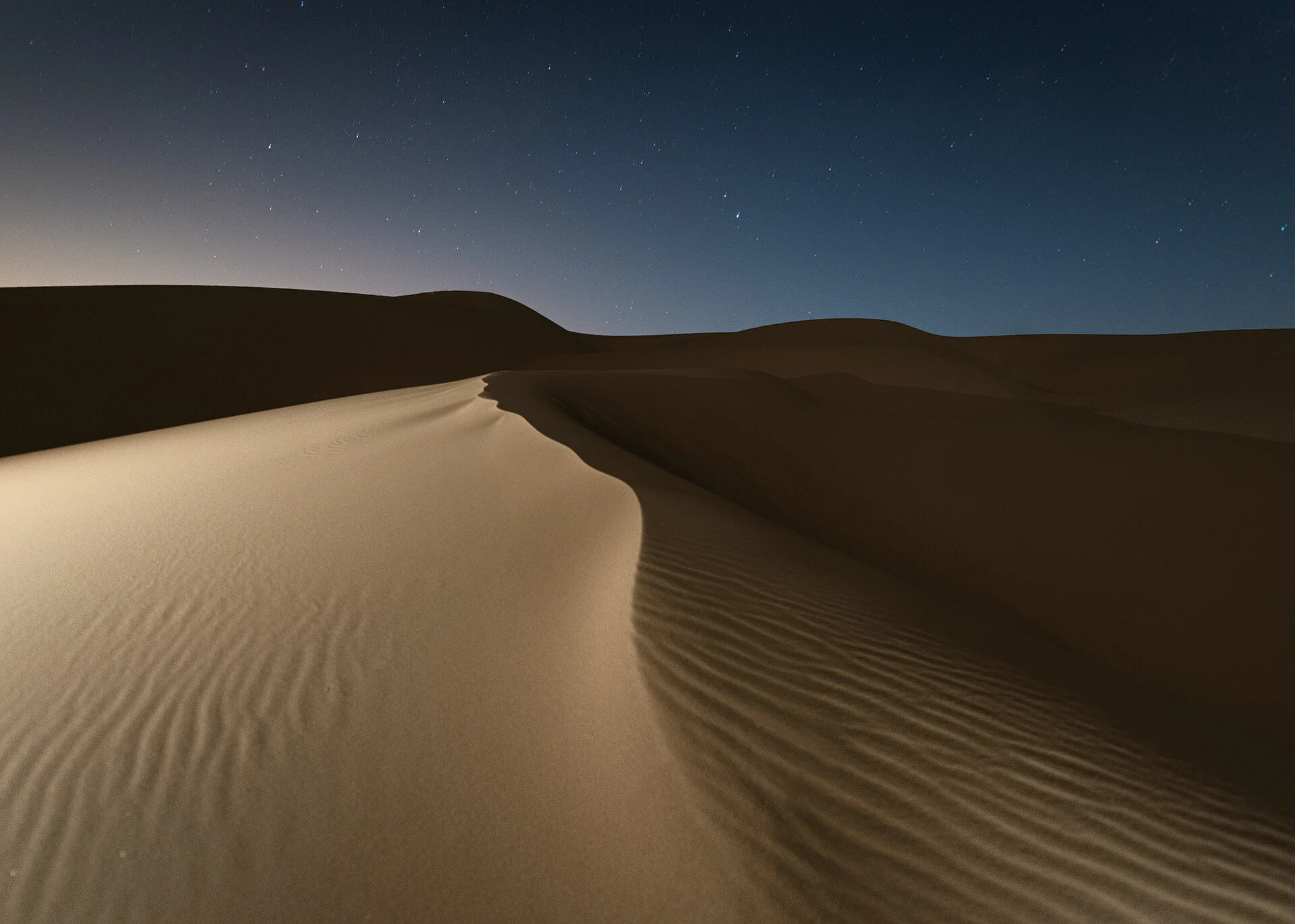 Thumbnail for long exposure nocturnal photography of glowing sand dunes under a starlit desert sky in Qatar by Hammad Iqbal