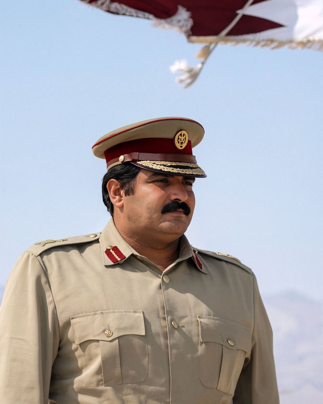  Reconstructed Portrait — Father Amir His Highness Sheikh Hamad bin Khalifa Al Thani in full Qatari military uniform outdoors. 