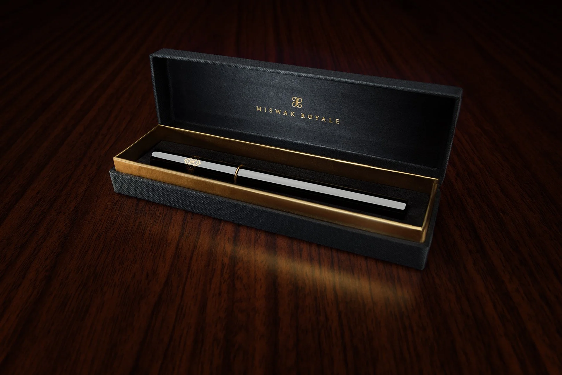 Commercial packaging photo showing open single case gift box with gold interior rim for Miswak Royale by Hammad Iqbal
