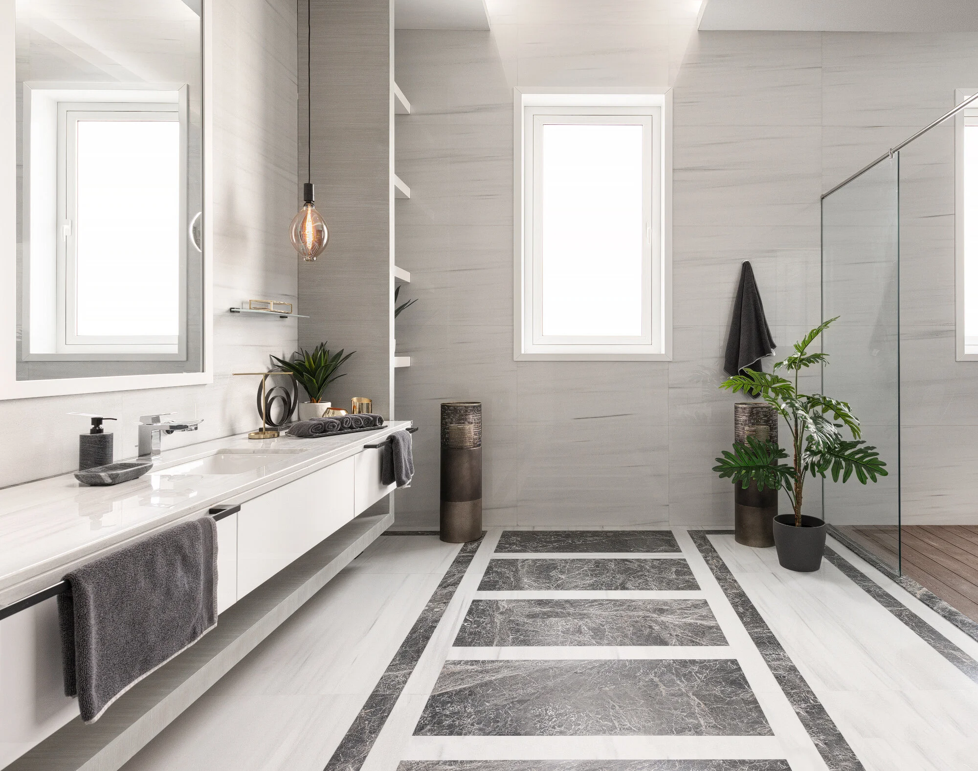 Contemporary master bathroom with floating marble vanity glass walk-in shower and stone tiling in a luxury West Wukair residence by Hammad Iqbal