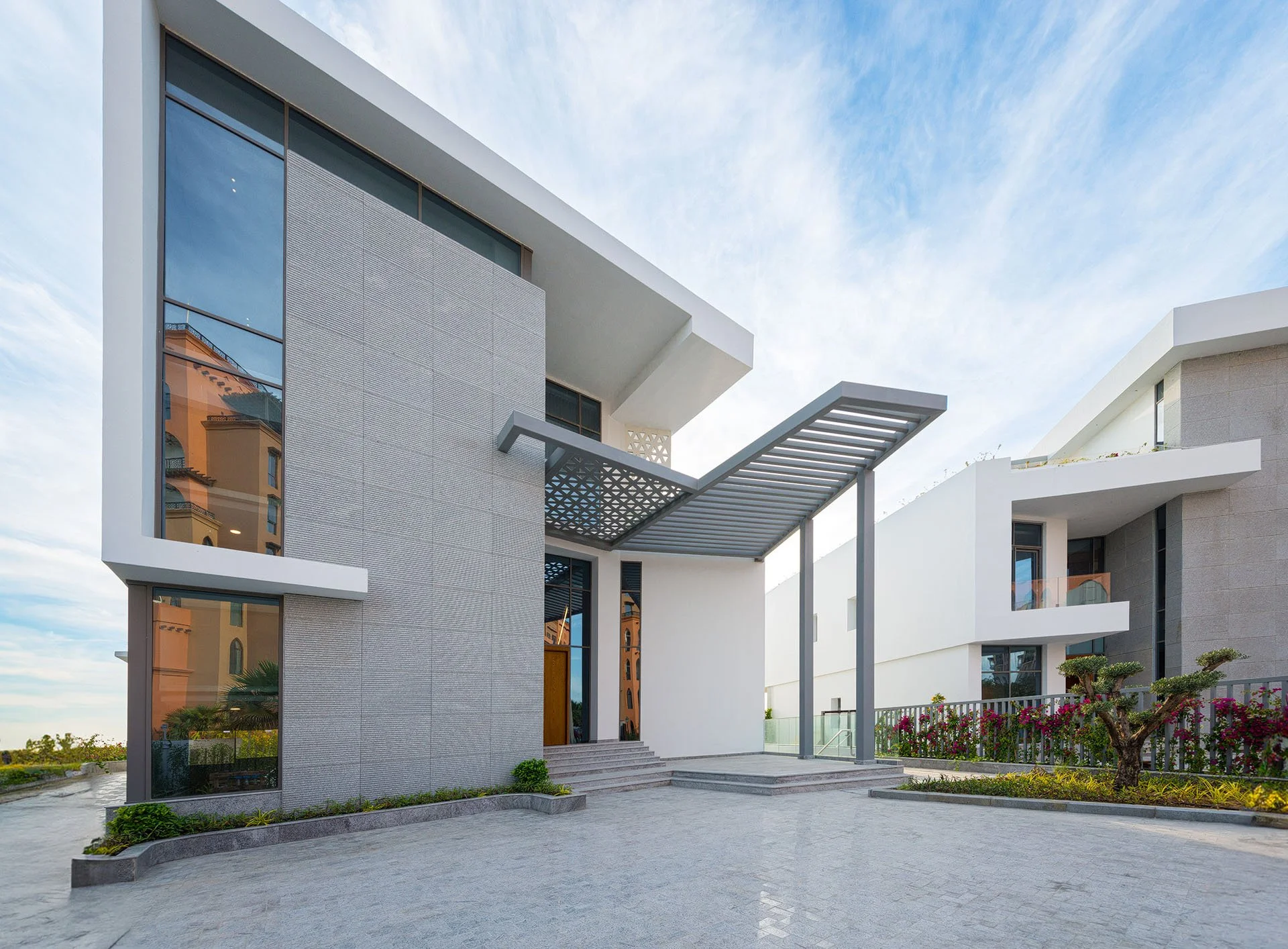 Daytime architectural photo of modern cantilever villa exterior facade at The Pearl Qatar by Hammad Iqbal