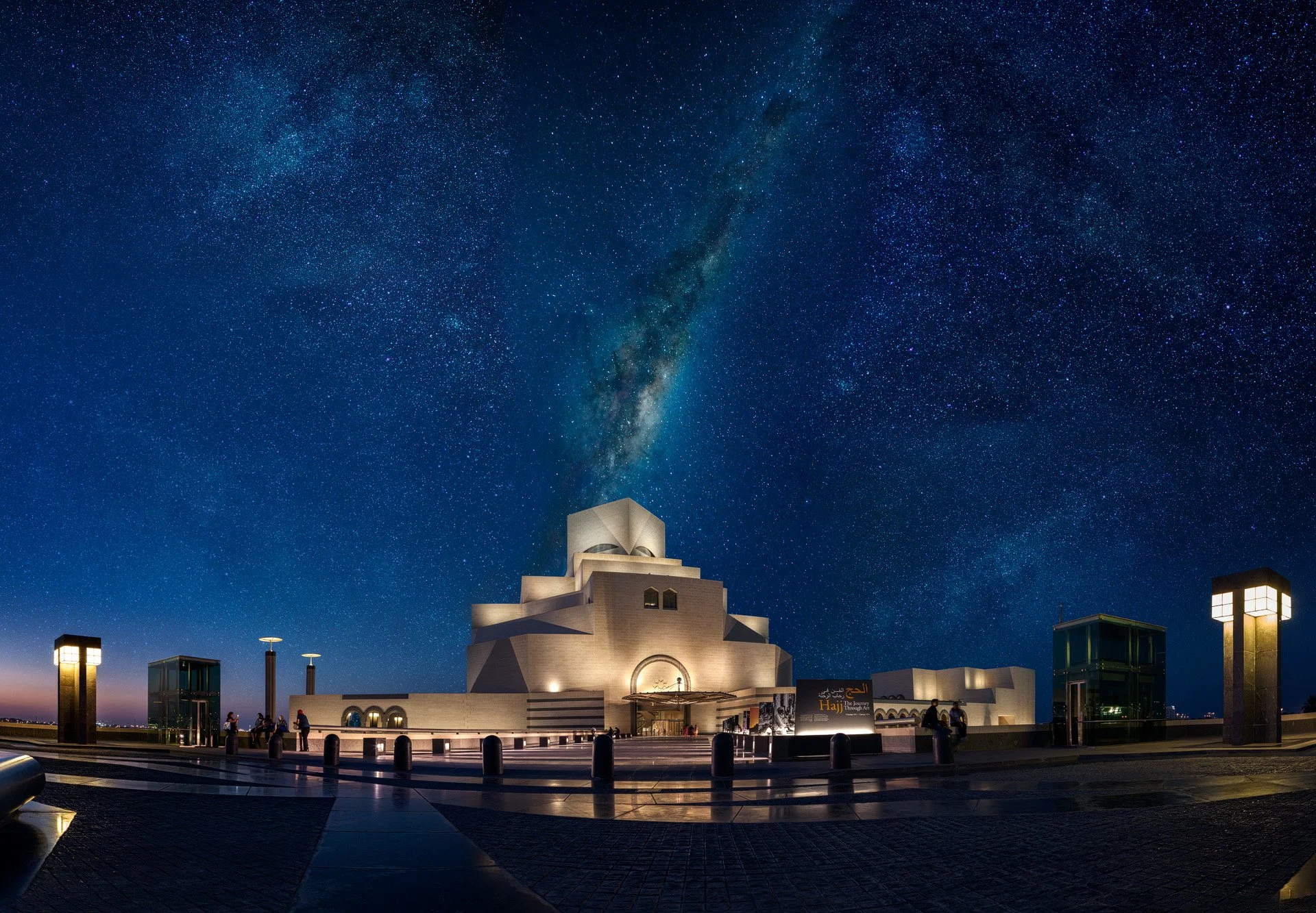 Exterior blue hour view of I.M. Pei's Museum of Islamic Art in Doha set against a composite Milky Way sky shot by architectural photographer Hammad Iqbal