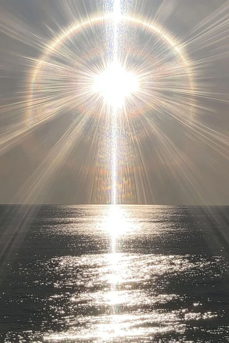 Image of the sun's rays over water