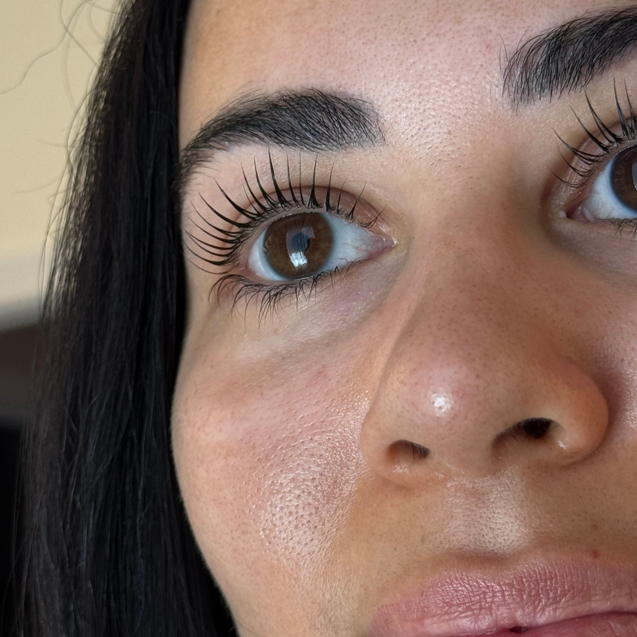 Close-up of natural lashes after a Korean Lash Lift at Arlis Artistry in Alpharetta.