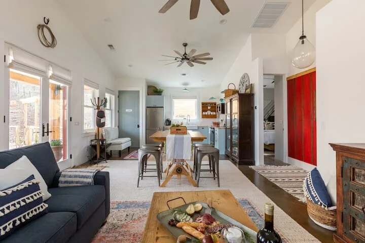 The Ranch House at Farm Blanc et Rouge features a spacious kitchen with high-end appliances, rustic cabinetry, and warm natural light, perfect for short or extended stays in Paso Robles.