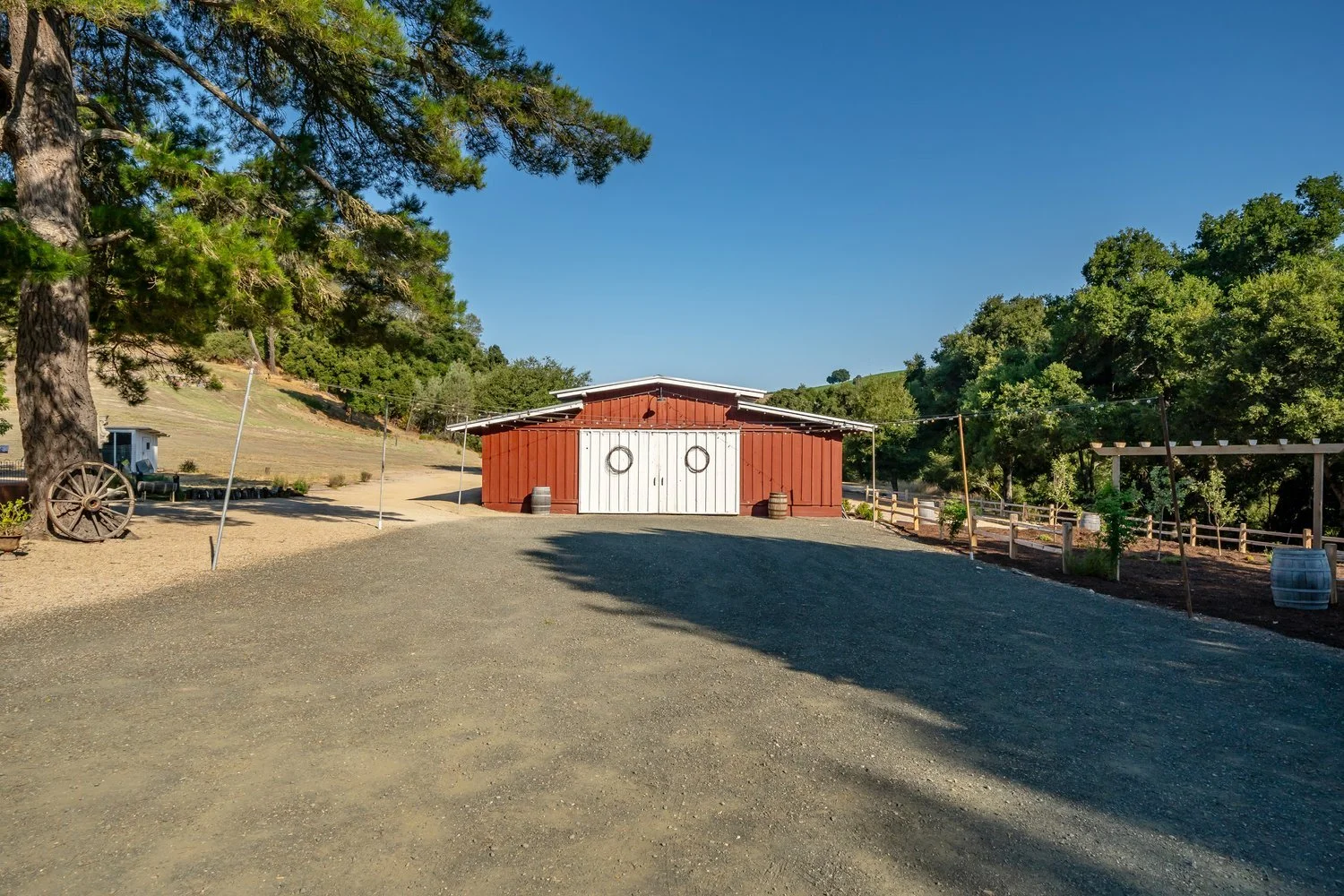 The Barn at Farm Blanc et Rouge with a Cal King bedroom, Queen bedroom, and couch, plus a large bath with two water closets. Sleeps 4 to 5 guests in a rustic-chic wine country retreat.