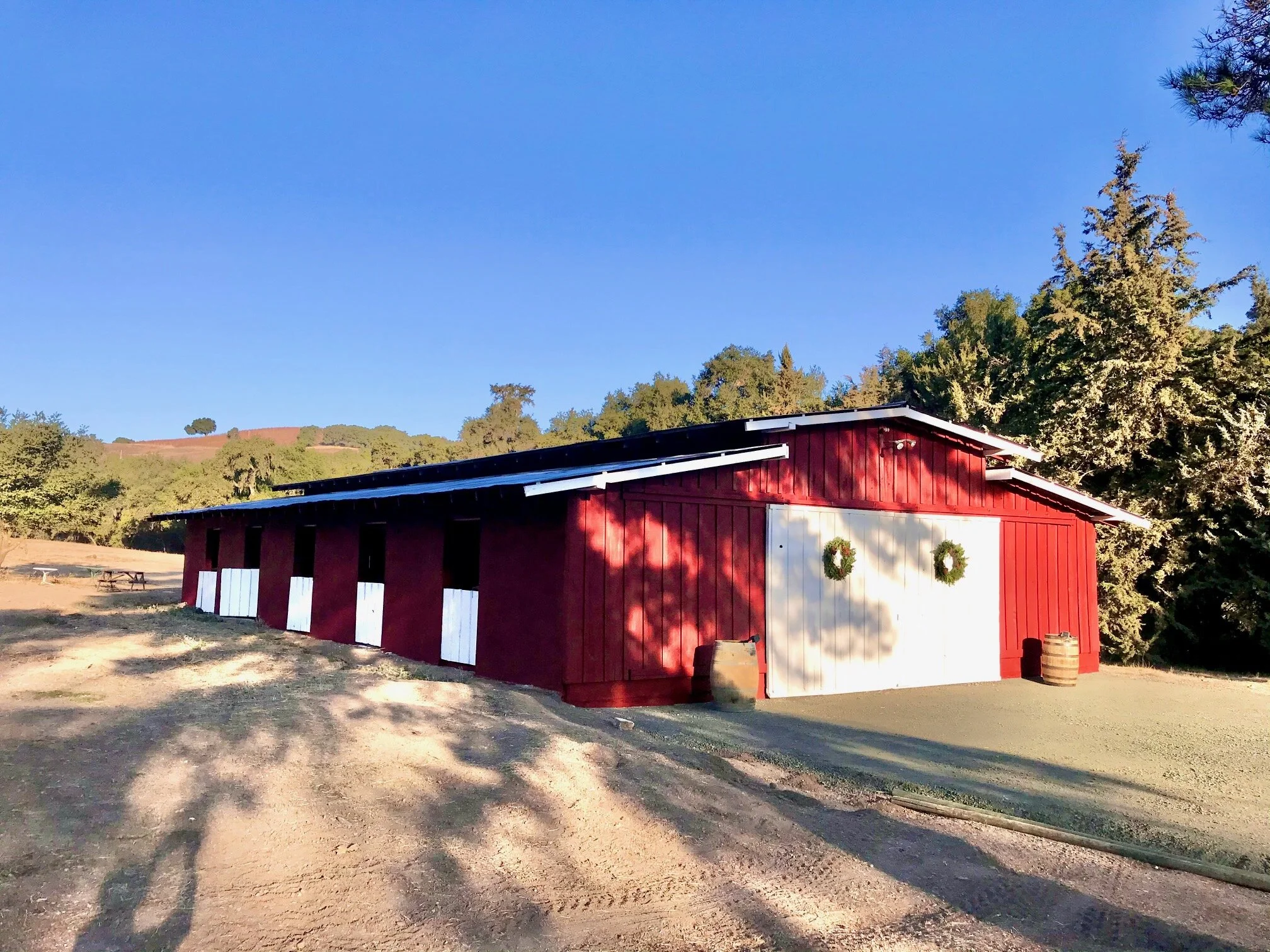The Barn at Farm Blanc et Rouge is a spacious, two-bedroom guest stay in Paso Robles with rustic charm, modern comforts, and a bold red barn exterior