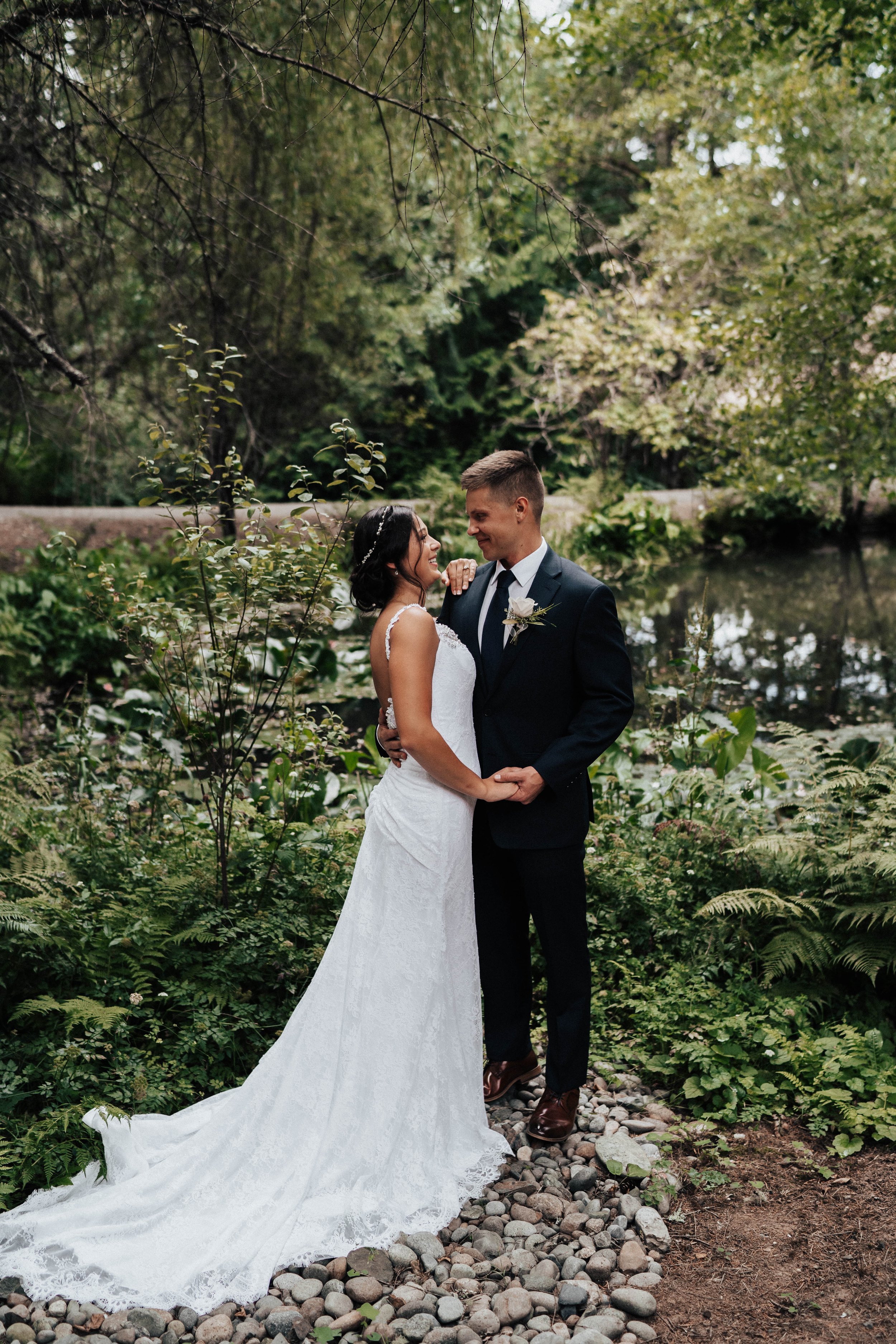 Seanna &amp; Damian bride and groom holding hands- Trinity Pines Ranch