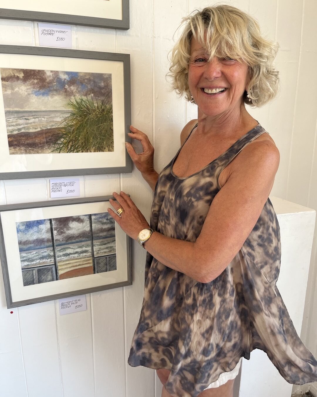 Helen Atkinson Wood finishes hanging her show which opens today at the Aldeburgh Beach Lookout.