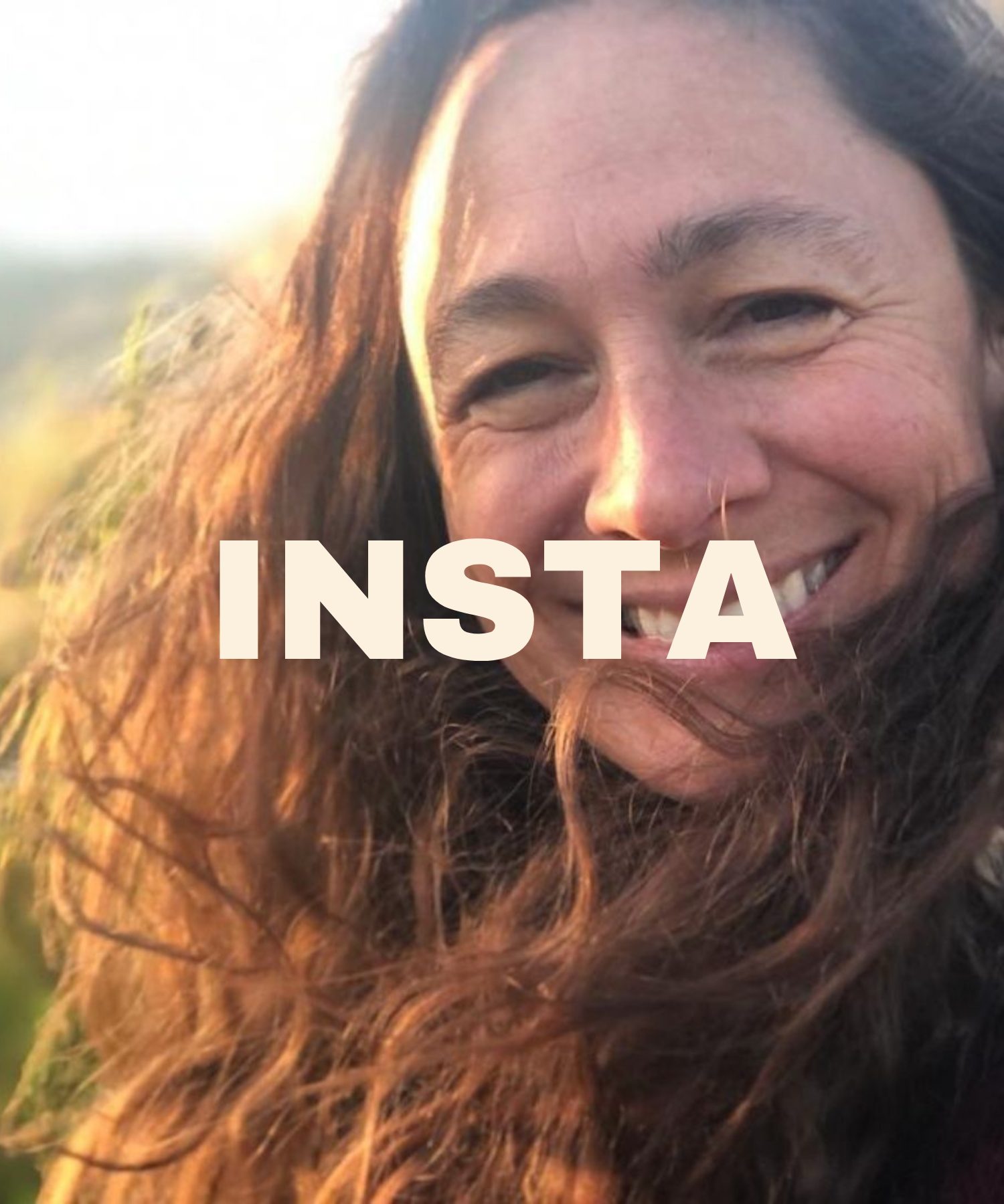 Transpersonal pyshcologist Kirsti smiling outdoors with sunlight on her face and long, curly brown hair, with 'INSTA' text overlaid.