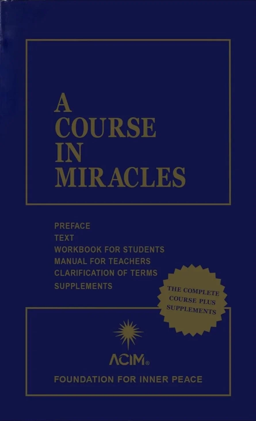 Book with deep blue cover with the title A Course in Miracles