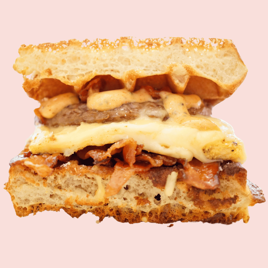 Egg Zeppelin: sausage or maple candied bacon, scrambled egg patty, gouda, swiss, paprika-chive aioli, sandwiched between a waffle (make vegan +3)