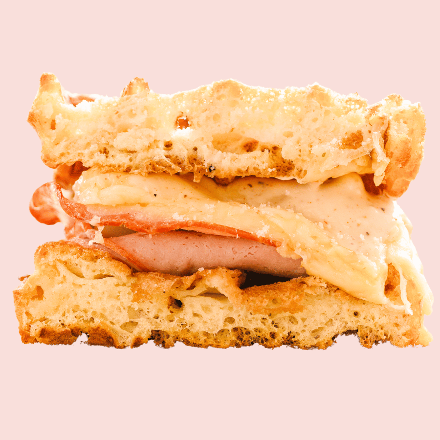 Morning Glory: sliced ham, smoked gouda, swiss, garlic aioli, sandwiched between a waffle