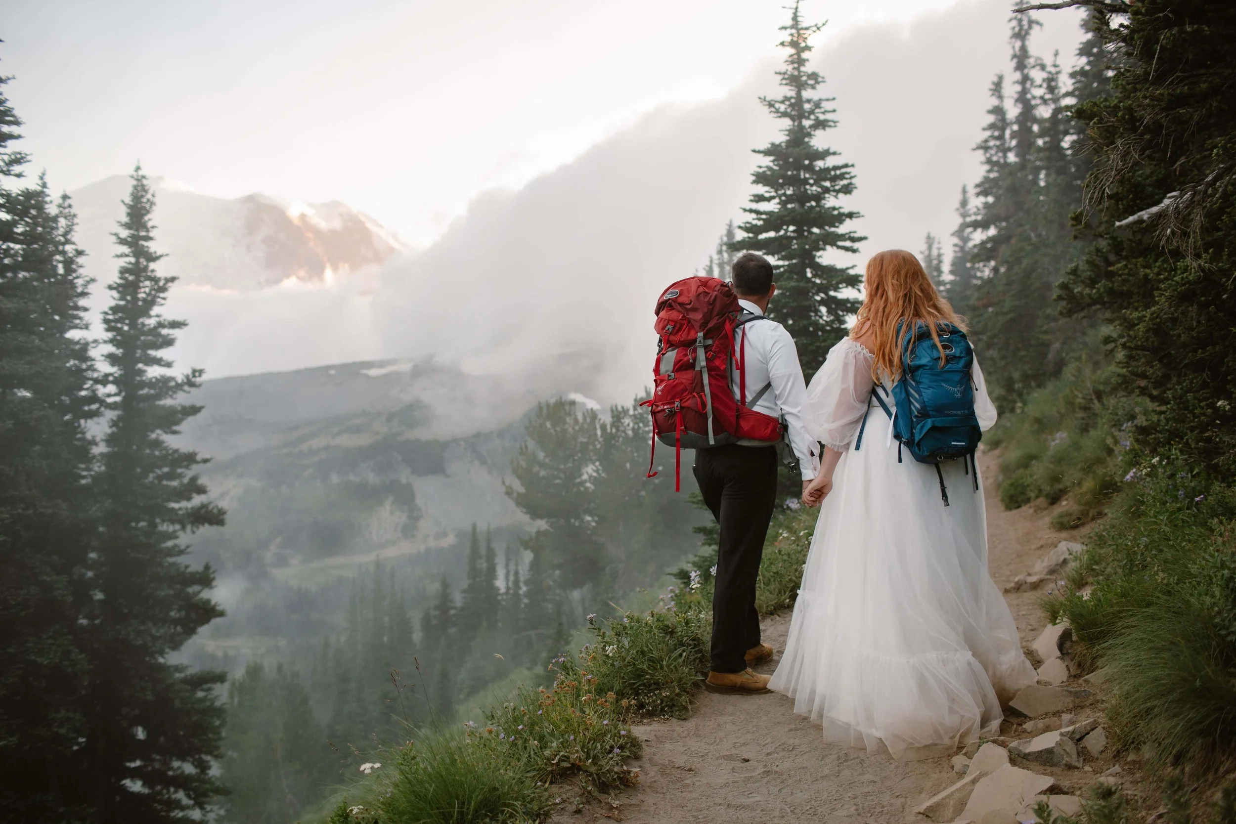 couple standing in fog after mt rainier elopement