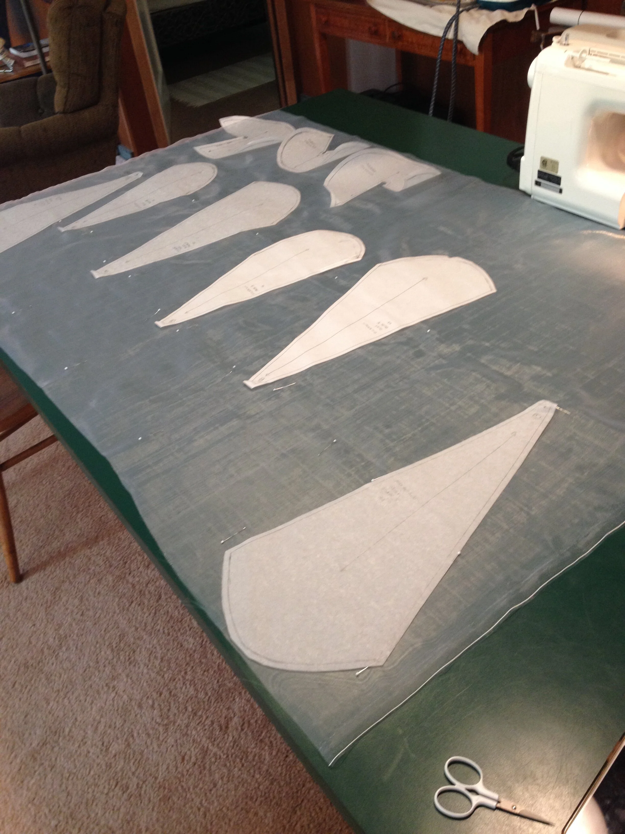 Laying overskirt panels on the corset mesh.