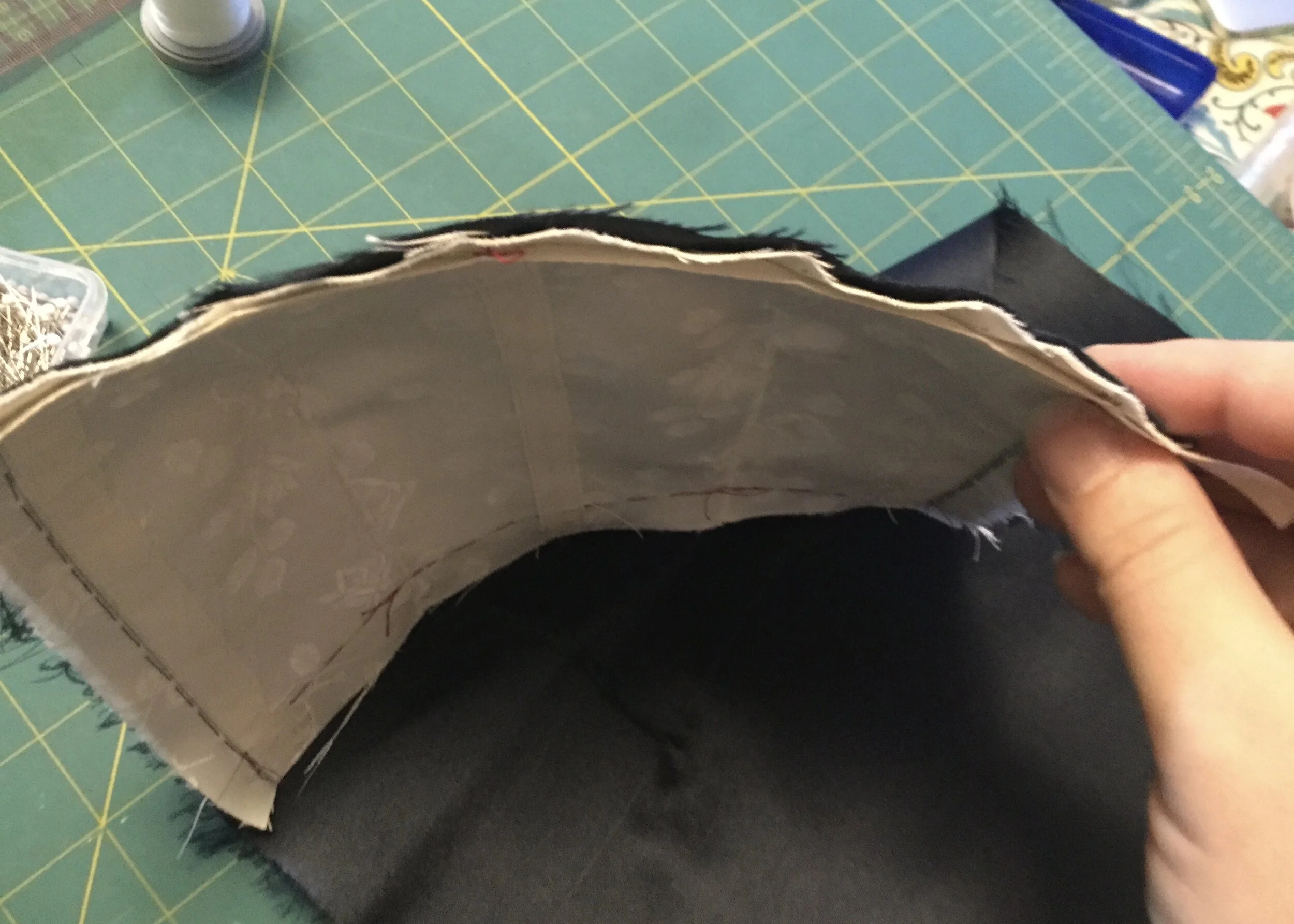 Curved top edge of the bodice.