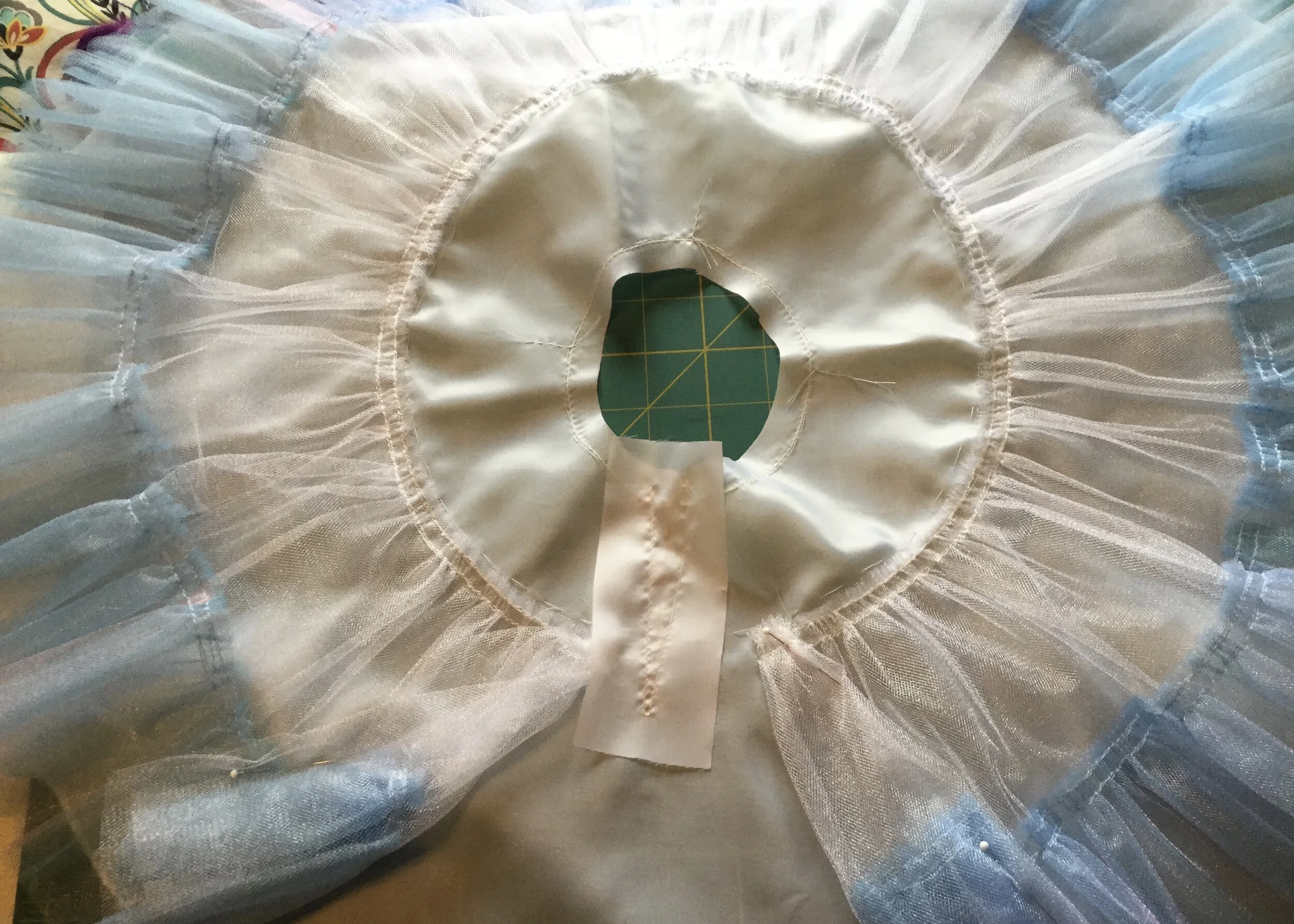 Applying placket facing.
