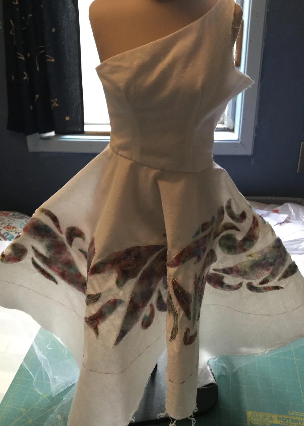 Skirt stitched to bodice.