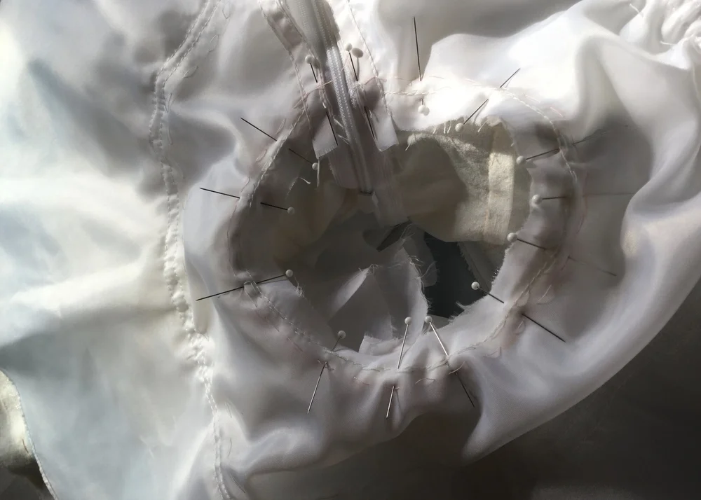 Pinning the skirt lining in place.