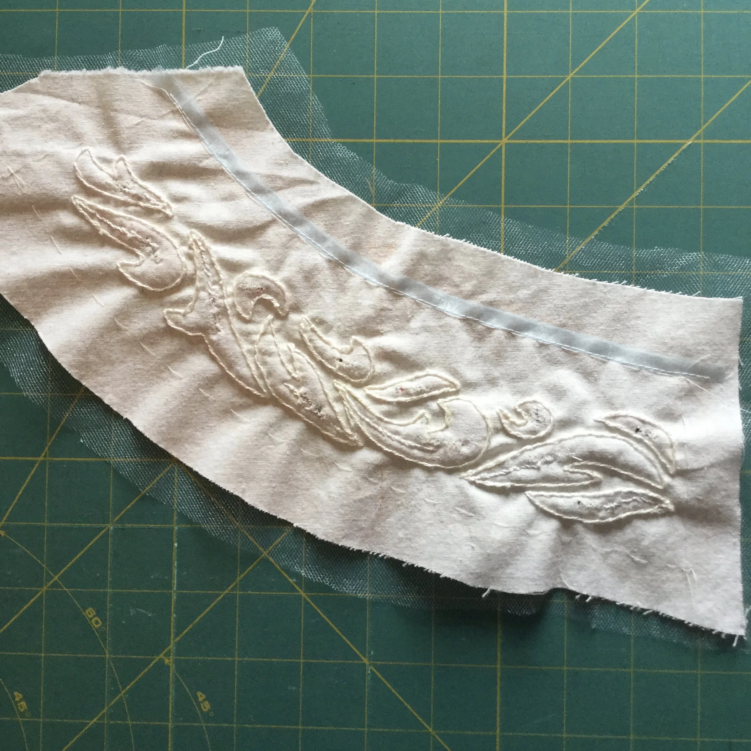 Front piece, stuffed with stabilizing along neckline.