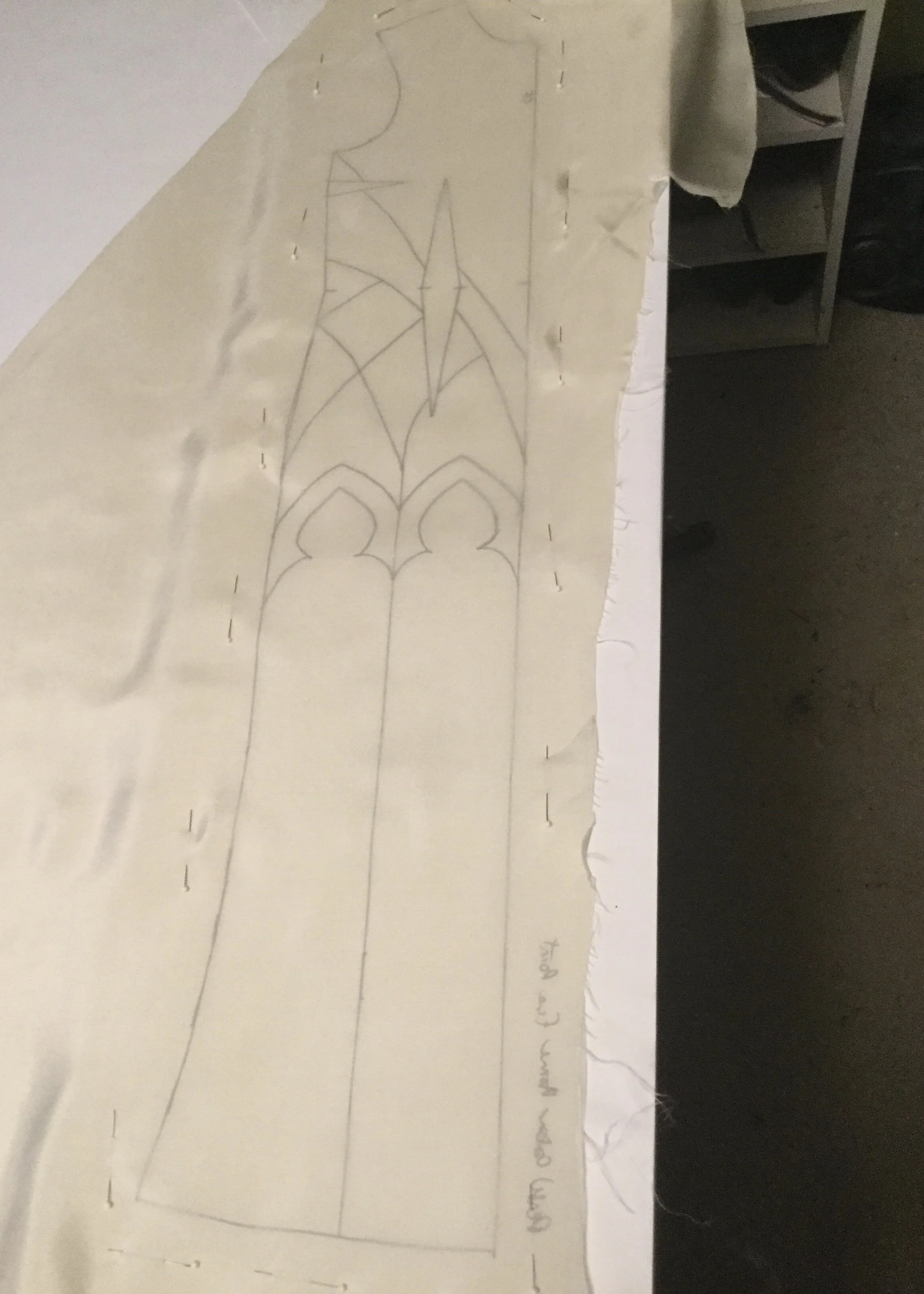 Tracing pattern onto the base fabric.