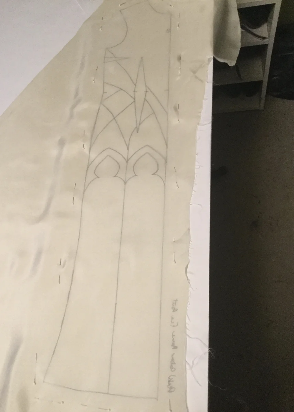 Tracing pattern onto the base fabric.