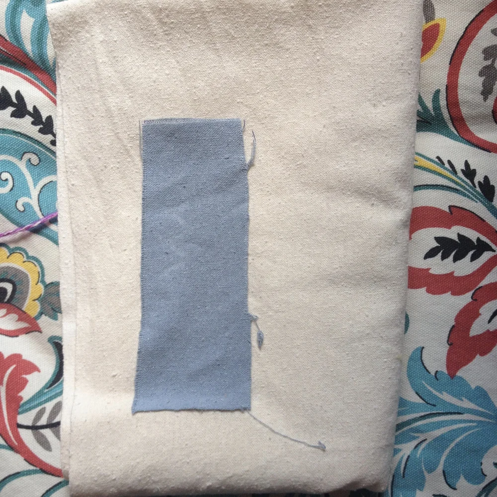 Dried sample next to undyed fabric.