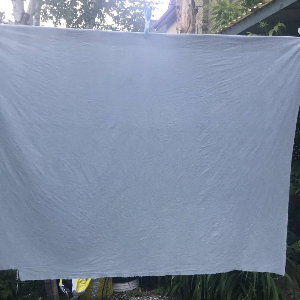 Drying the dyed fabric.