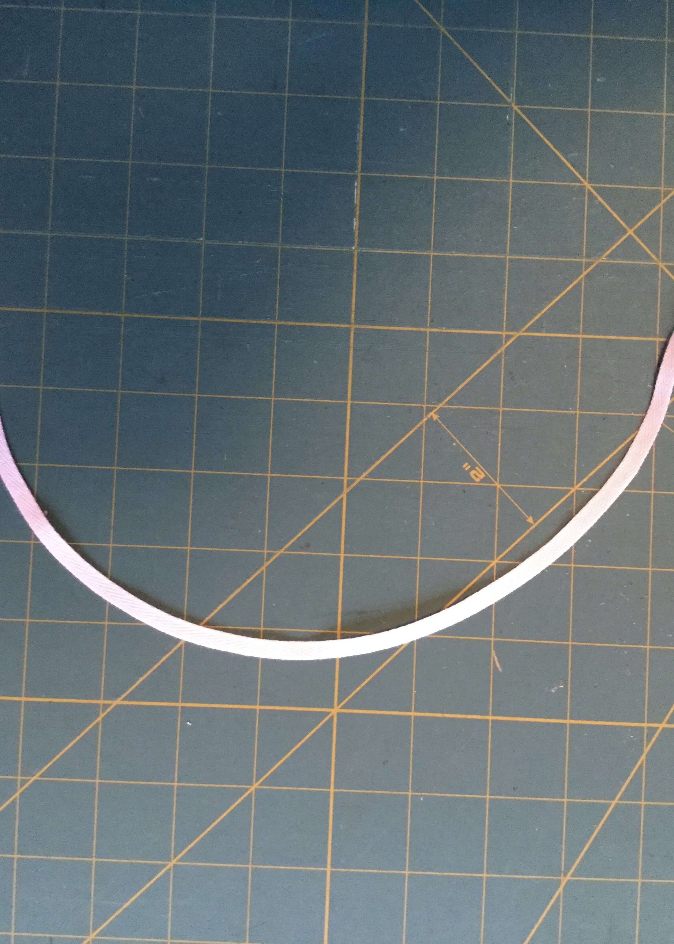 Curved twill tape.