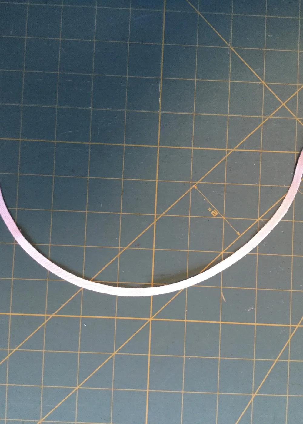 Curved twill tape.