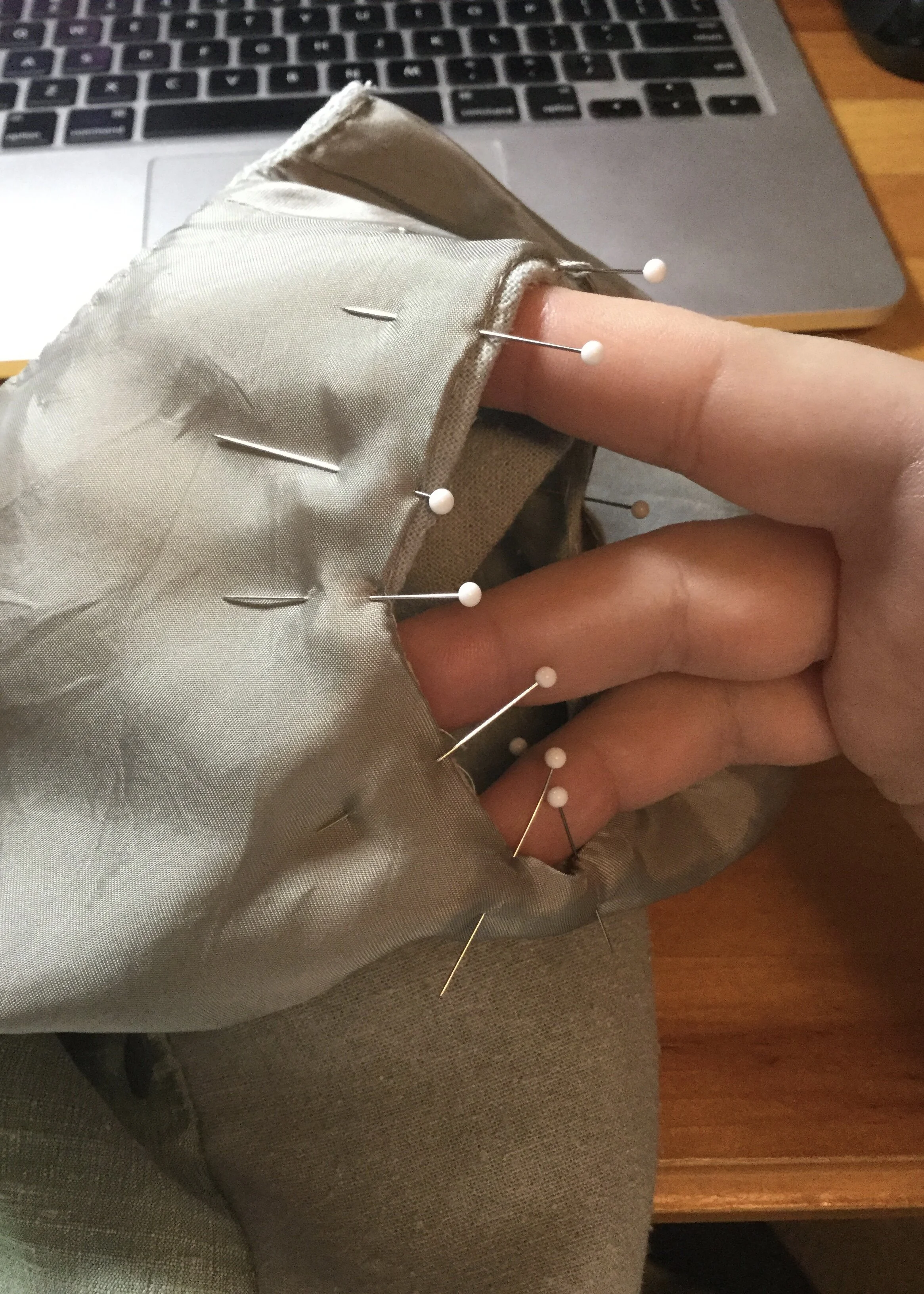 Pinning the lining to the right armhole.
